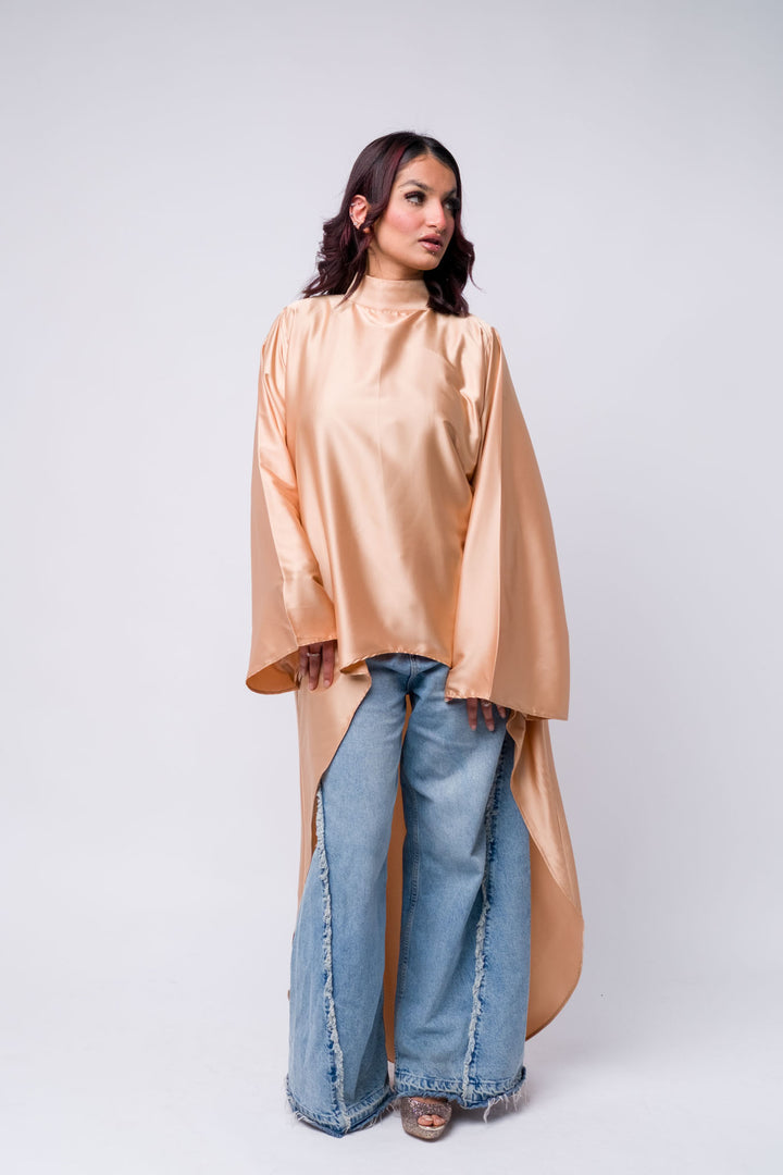 Elegant modest outfit with satin peach top and frayed jeans – fashion for women