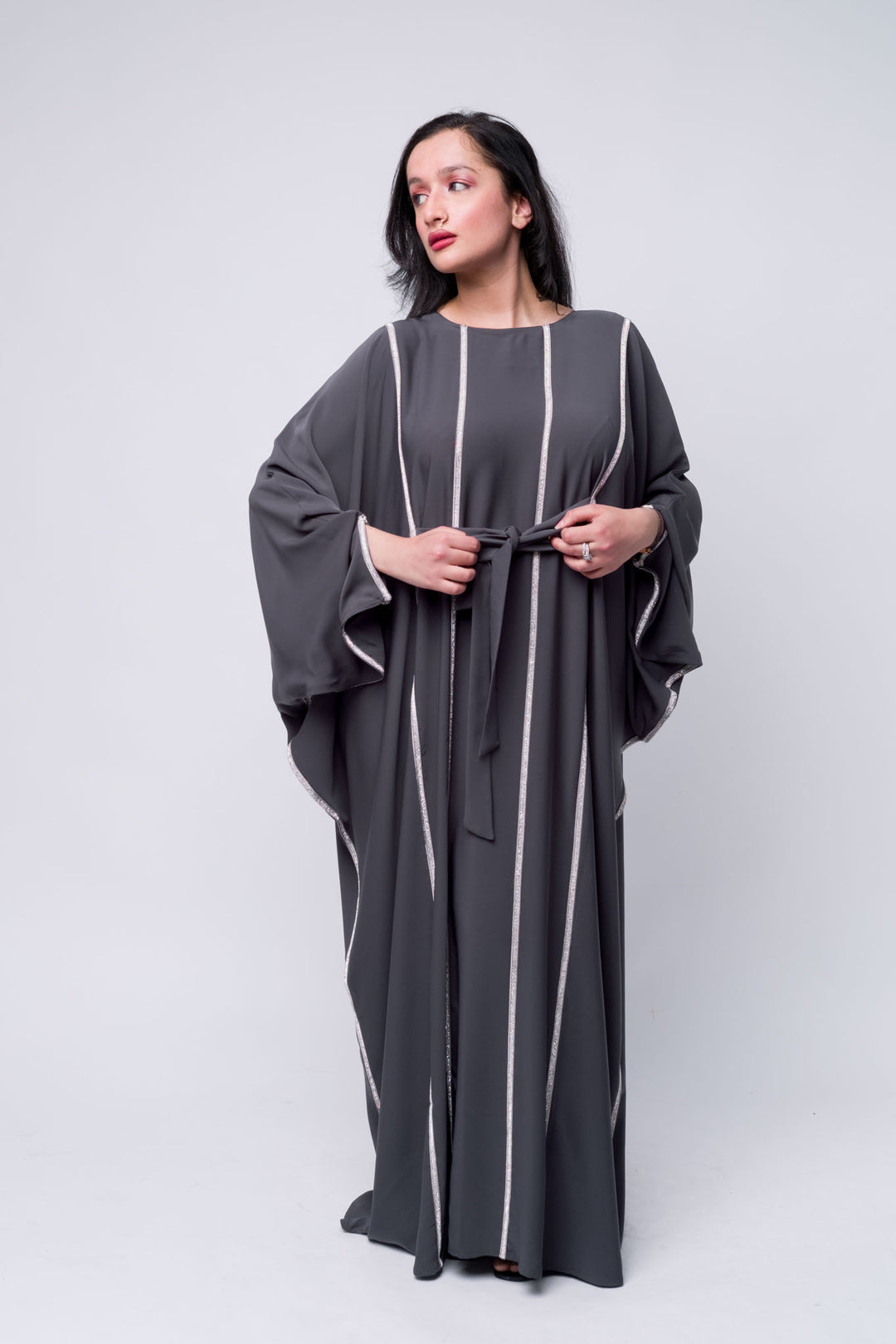 Modern grey abaya with shimmer stripes and tie-waist – modest and fashionable Islamic dress.