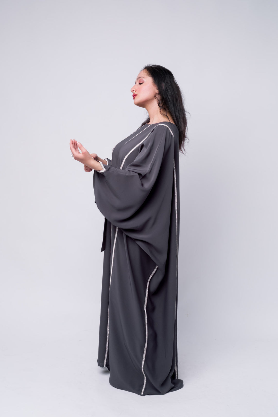 Sophisticated women's grey abaya with rhinestone vertical lines – modest formal wear. 