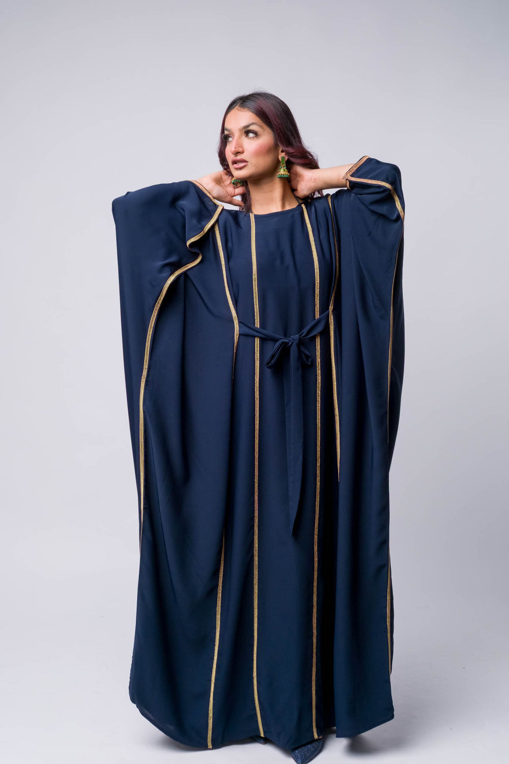 Modest navy abaya kaftan with gold trim, perfect for Ramadan, weddings, or evening wear.