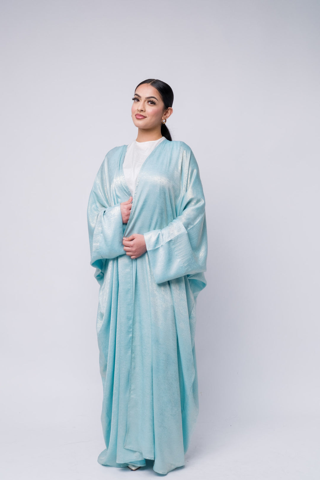 Shimmering light blue abaya with glossy finish, modest fashion for Eid, Ramadan, or special occasions