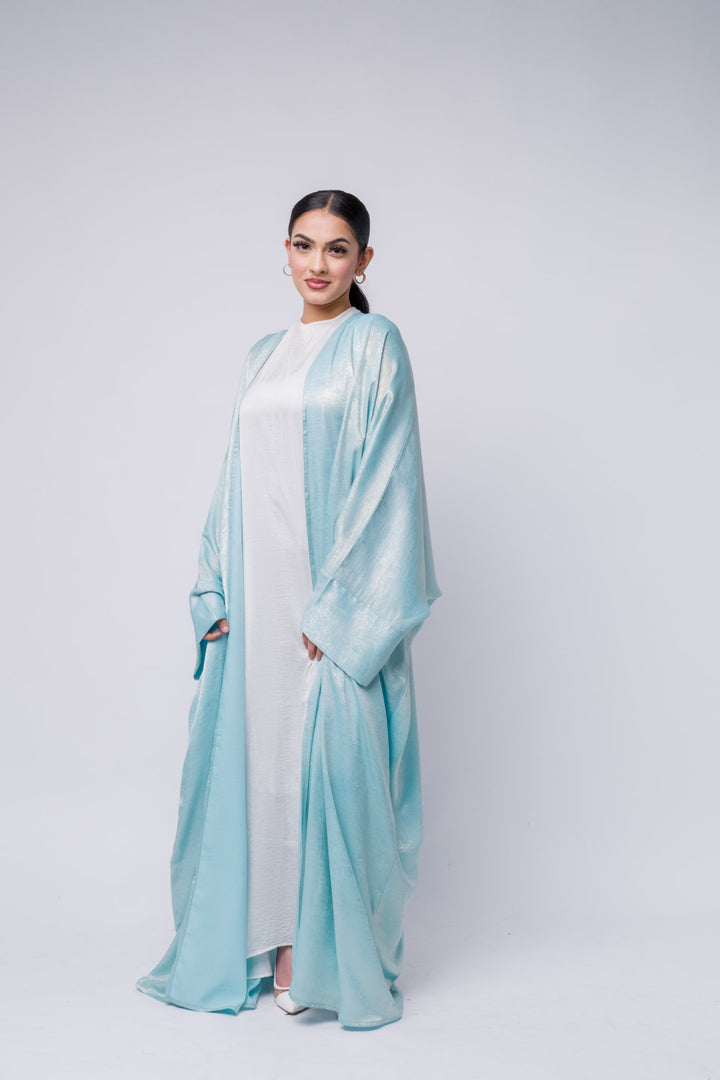  Luxury blue abaya with glossy sheen, stylish and modern modest fashion piece 
