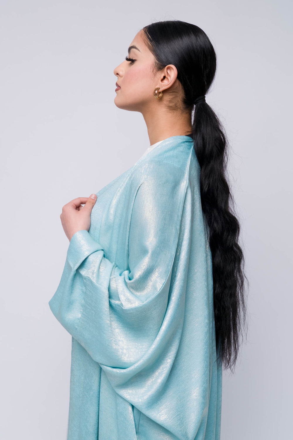 Elegant satin-look farasha abaya in metallic blue, modern modest wear for women