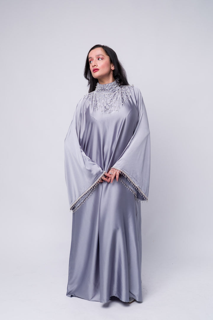 Modest grey abaya with pearl embellishments – Islamic fashion outfit for formal occasions sleeves.