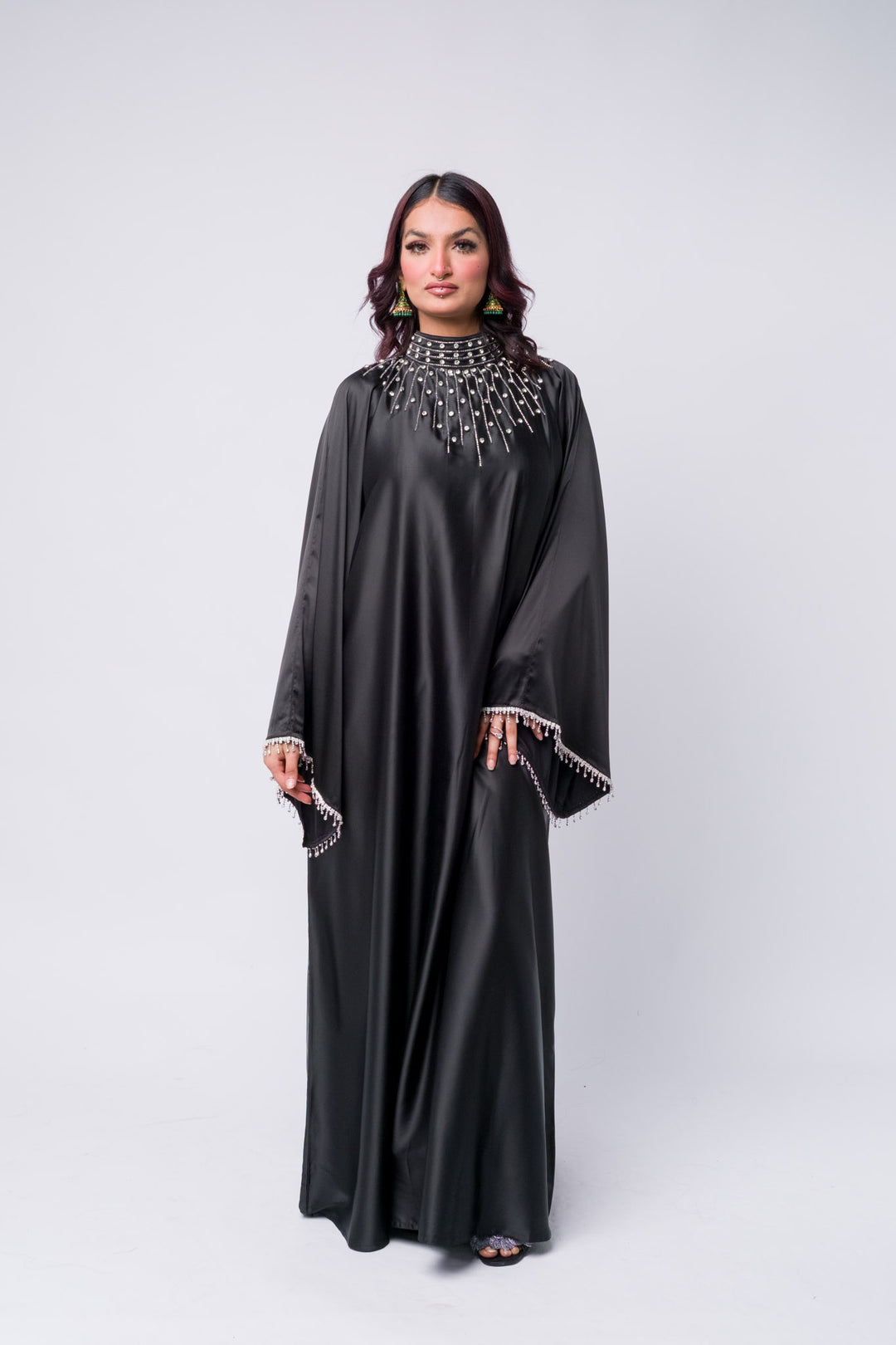Elegant black abaya with statement embellishments – modest wear for formal occasions. Batwing abaya