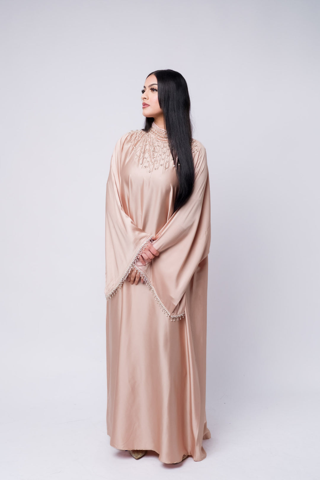 Satin embellished beige abaya for women – modest formal dress with pearl details. Batwing abaya 