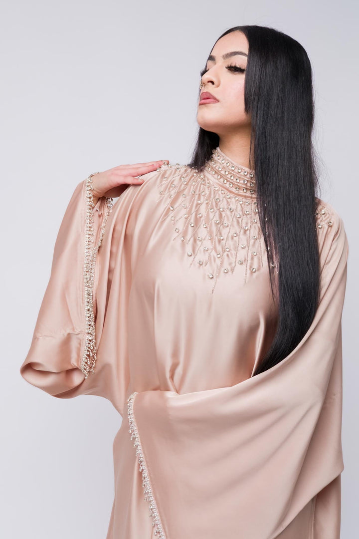 Pink abaya with intricate beaded high neckline and fringe beaded sleeves.