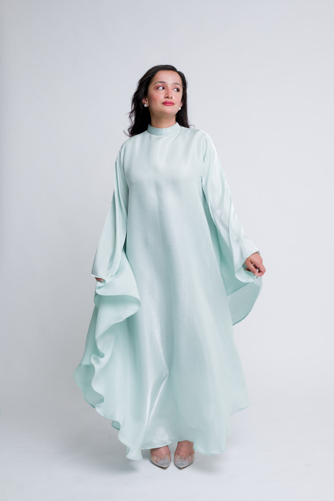 Flowing pastel green modest kaftan with embellishments