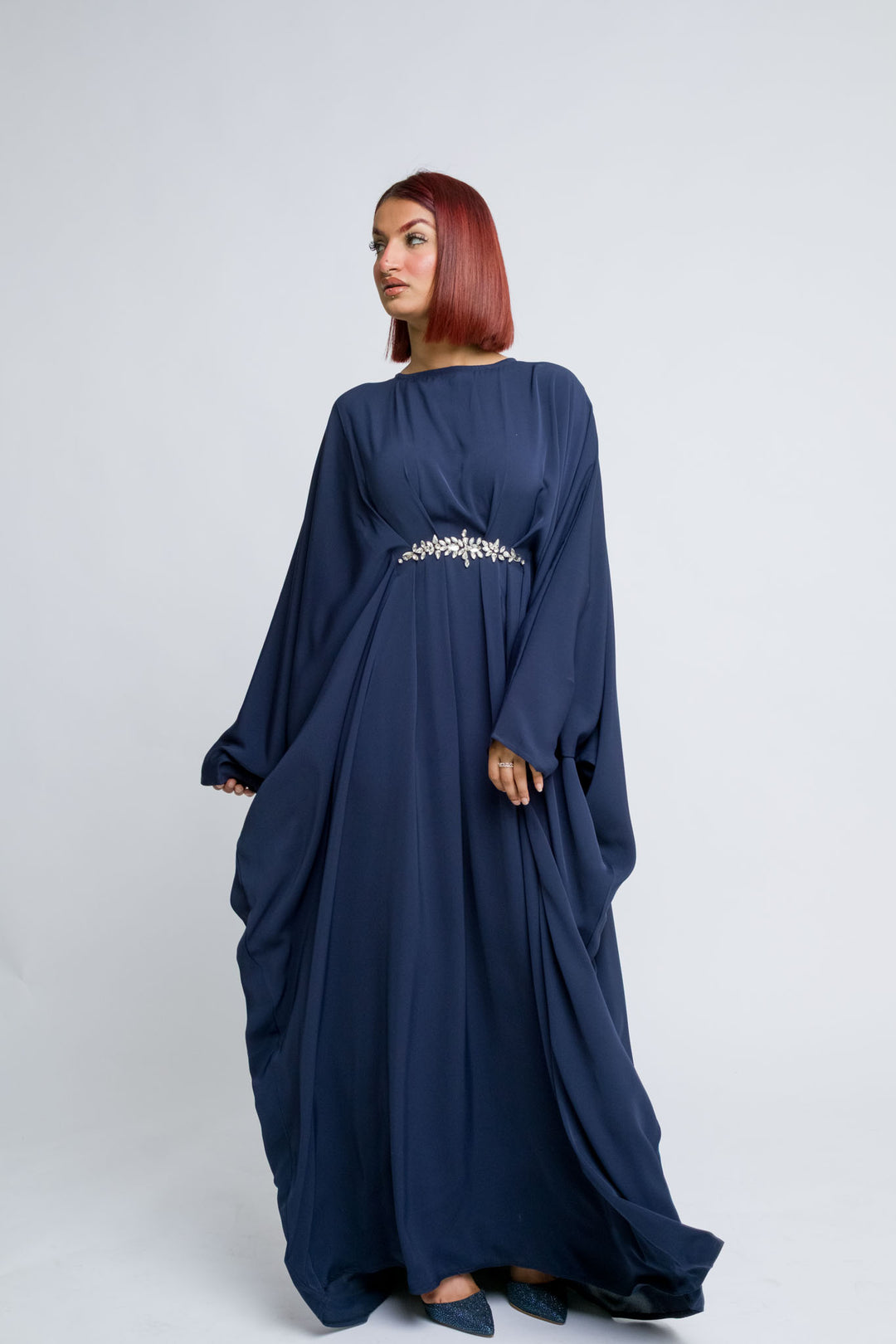 Modest navy abaya with flowing sleeves and crystal belt