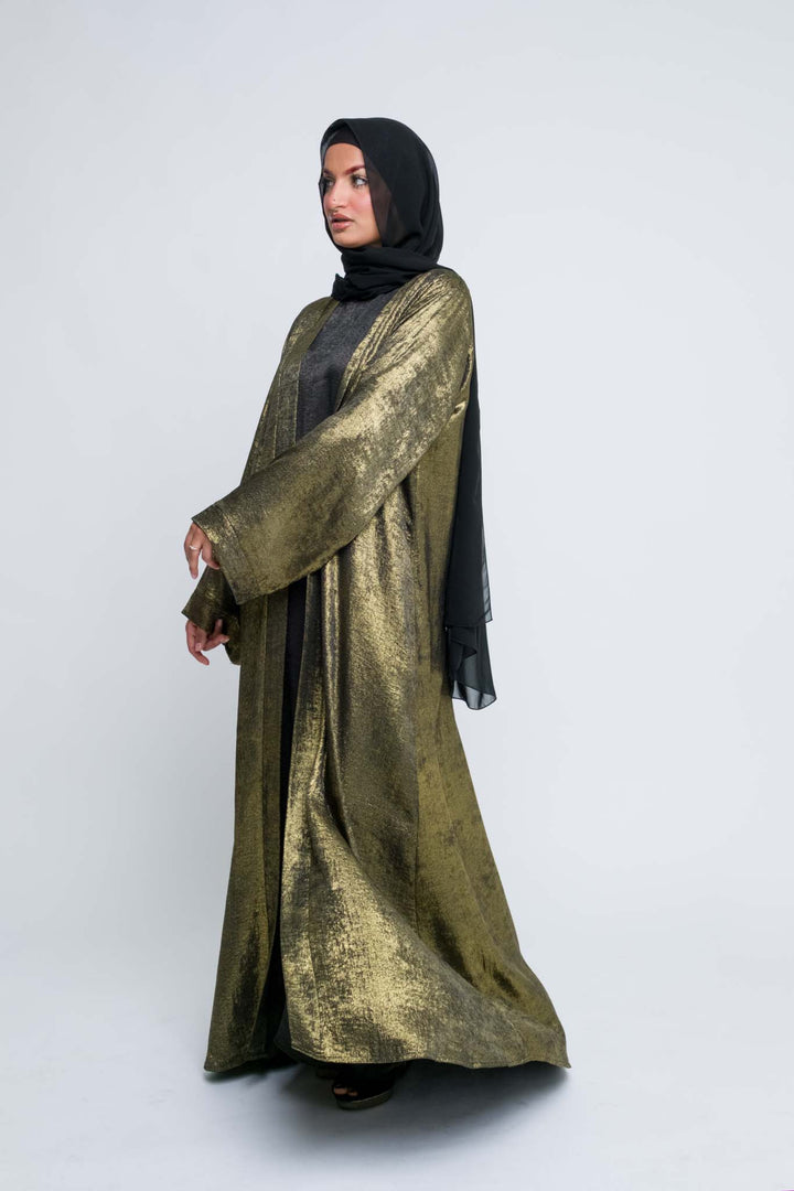 Shimmer gold abaya dress styled with black hijab
