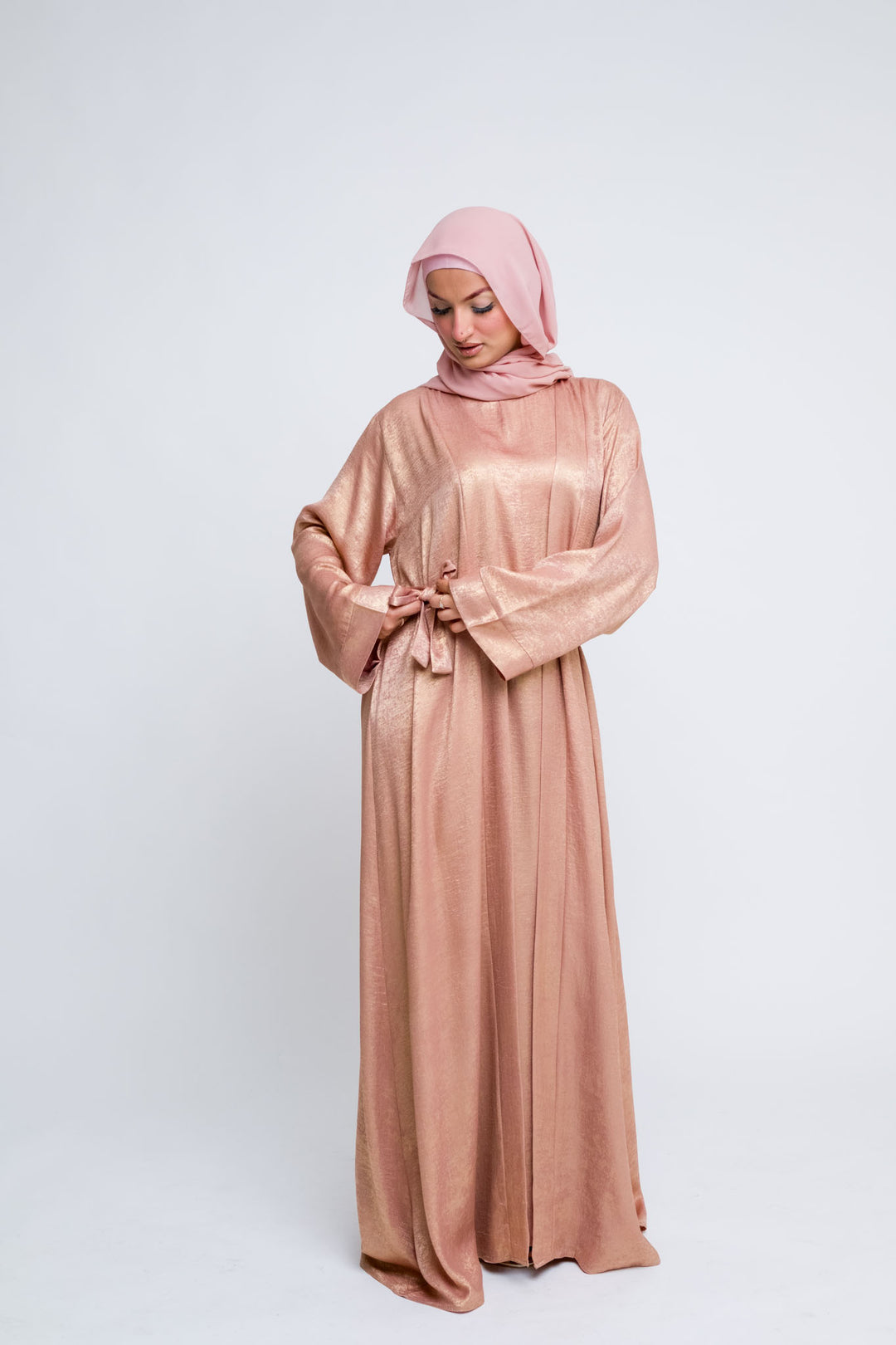 Modest rose gold abaya outfit with belt and hijab