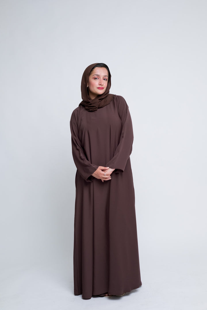 Elegant brown abaya with hijab for women, modest Islamic dress perfect for prayer and everyday wear.