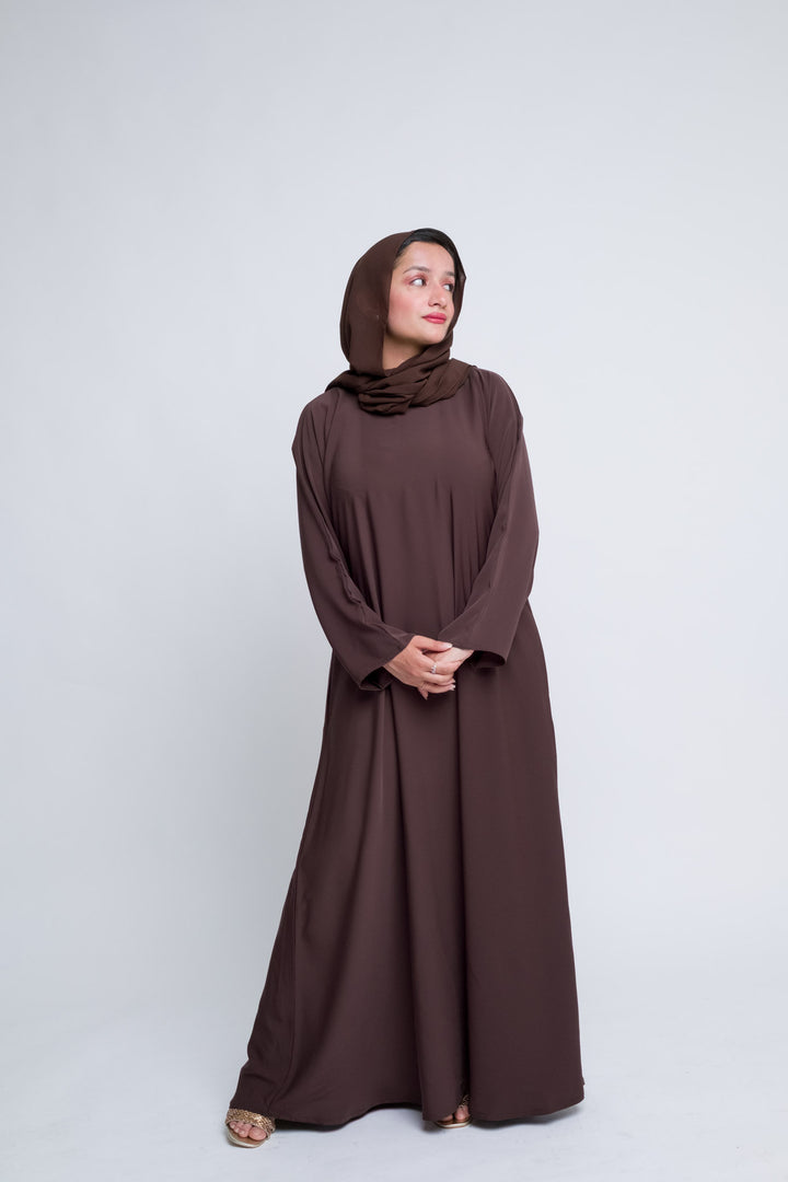 Stylish brown abaya dress with long sleeves, ideal for Islamic wear and formal occasions.
