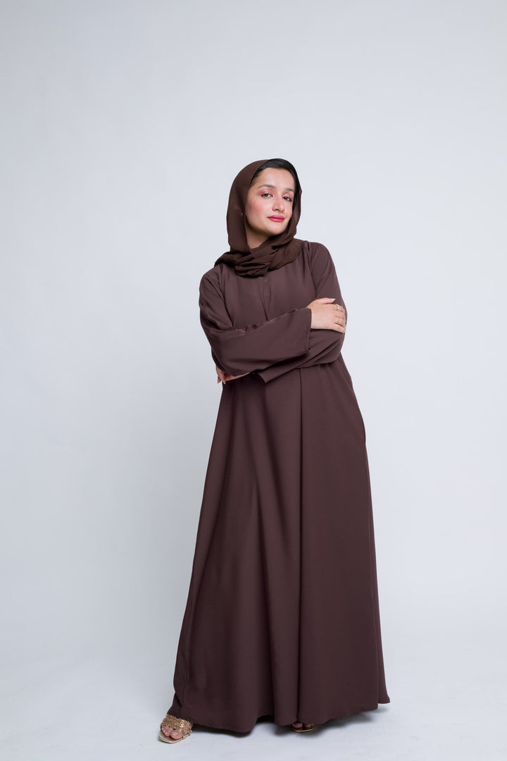 Classic brown abaya for Muslim women, perfect for daily wear, prayer, and gatherings. 