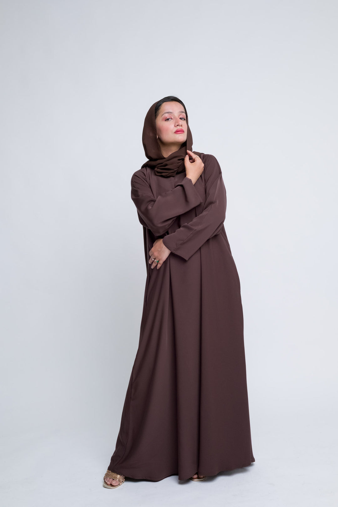 Chic brown abaya outfit with soft matching hijab, perfect for Eid and Islamic events.