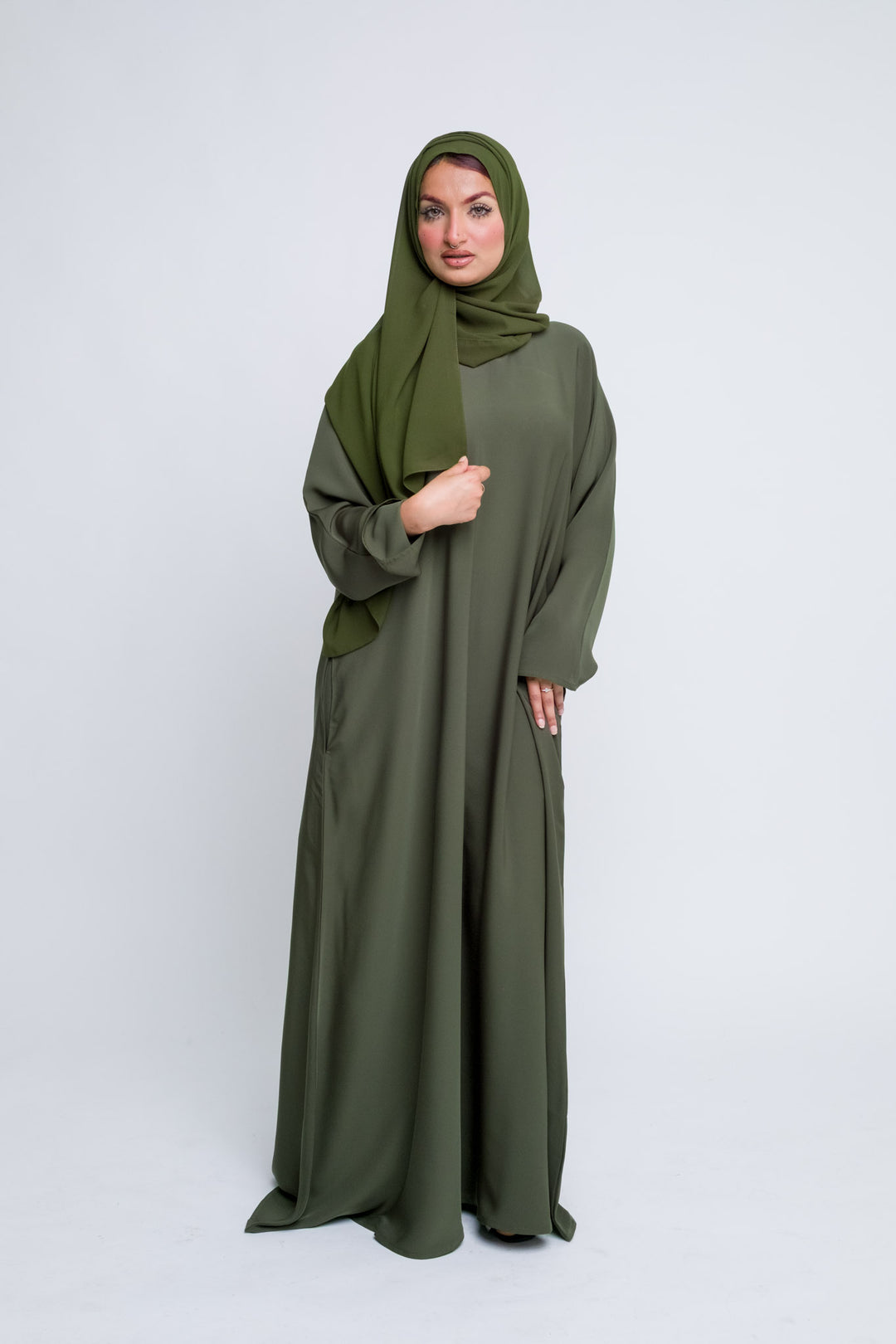 Long sleeve olive abaya dress with soft fabric, classic and stylish modest wear. 
