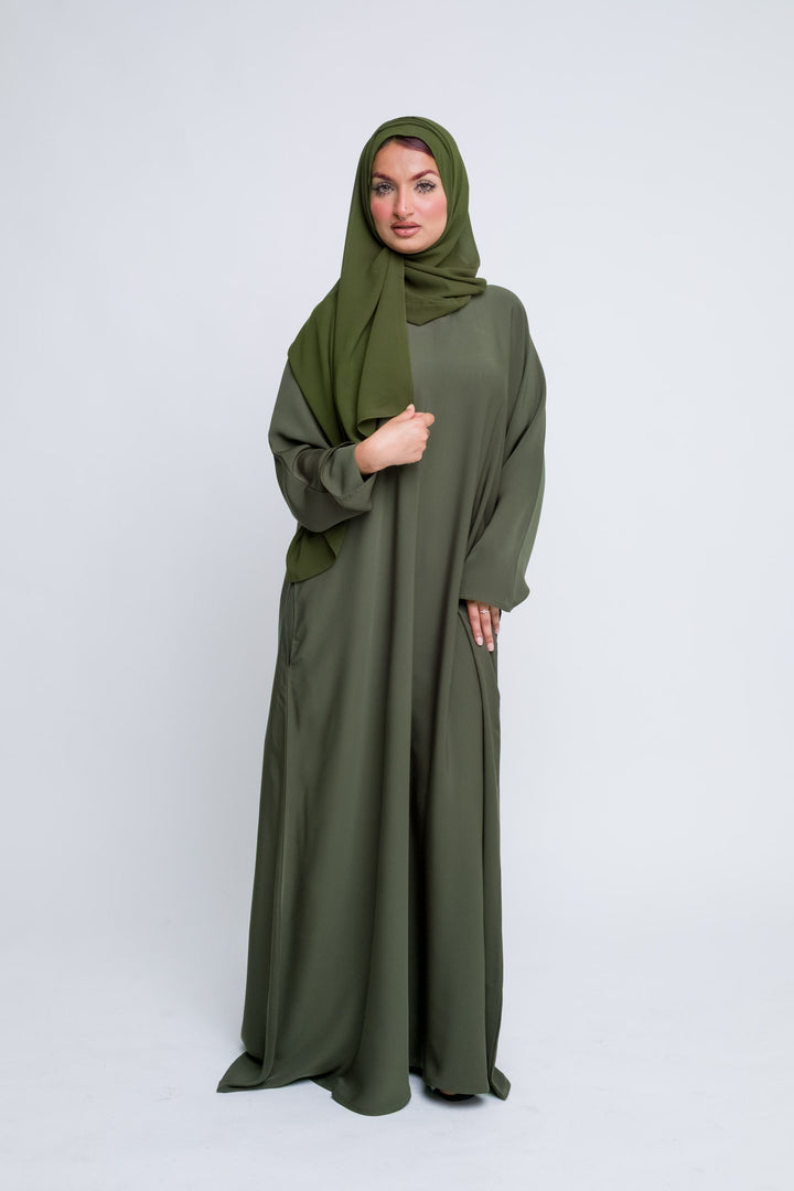 Modest olive green abaya set for women, elegant and comfortable for all seasons.