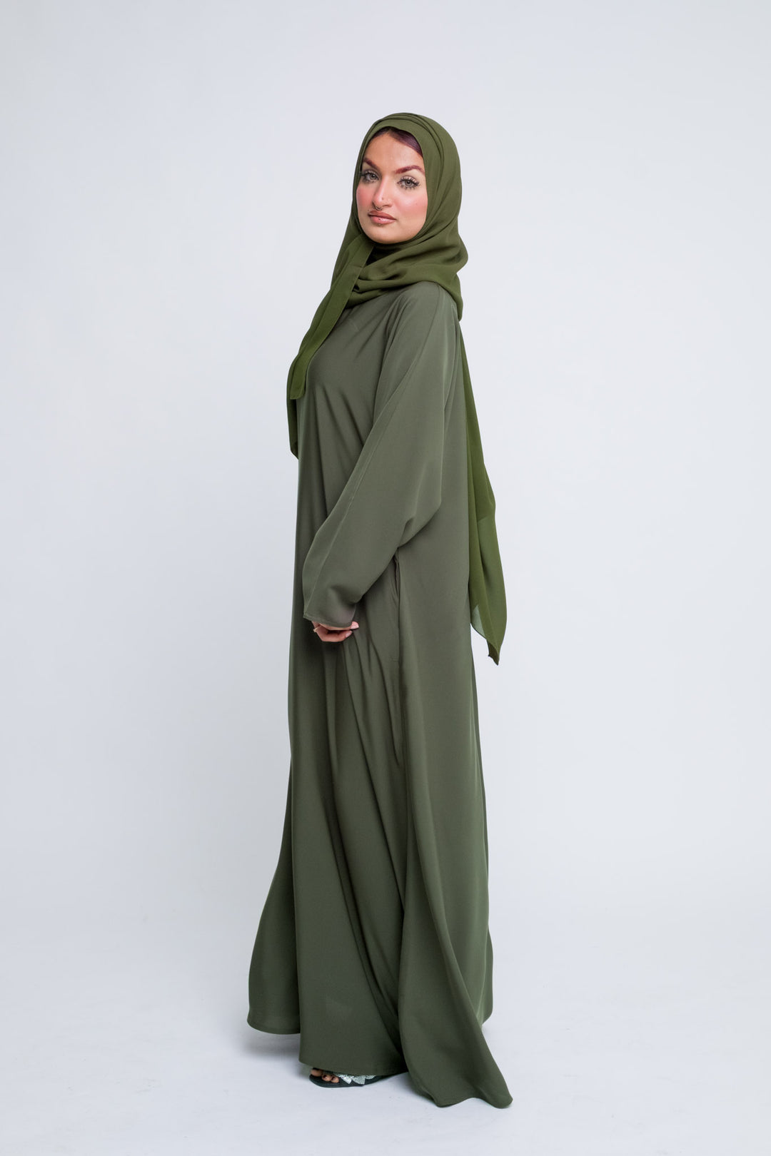 Full-length modest olive abaya with belt, soft fabric and perfect for Eid or prayer. 