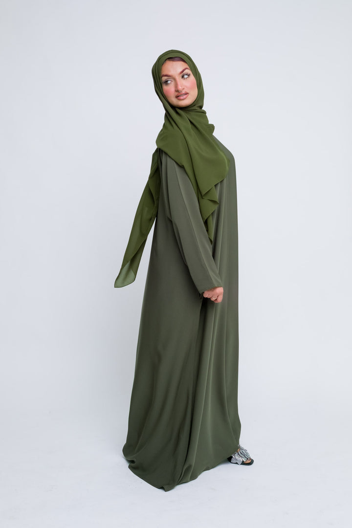 Modest olive green abaya set for women, elegant and comfortable for all seasons.