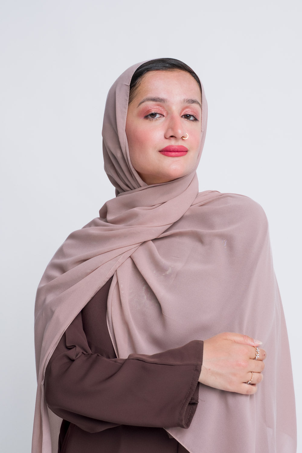 Dusty rose chiffon hijab styled in soft drapes for everyday modest looks