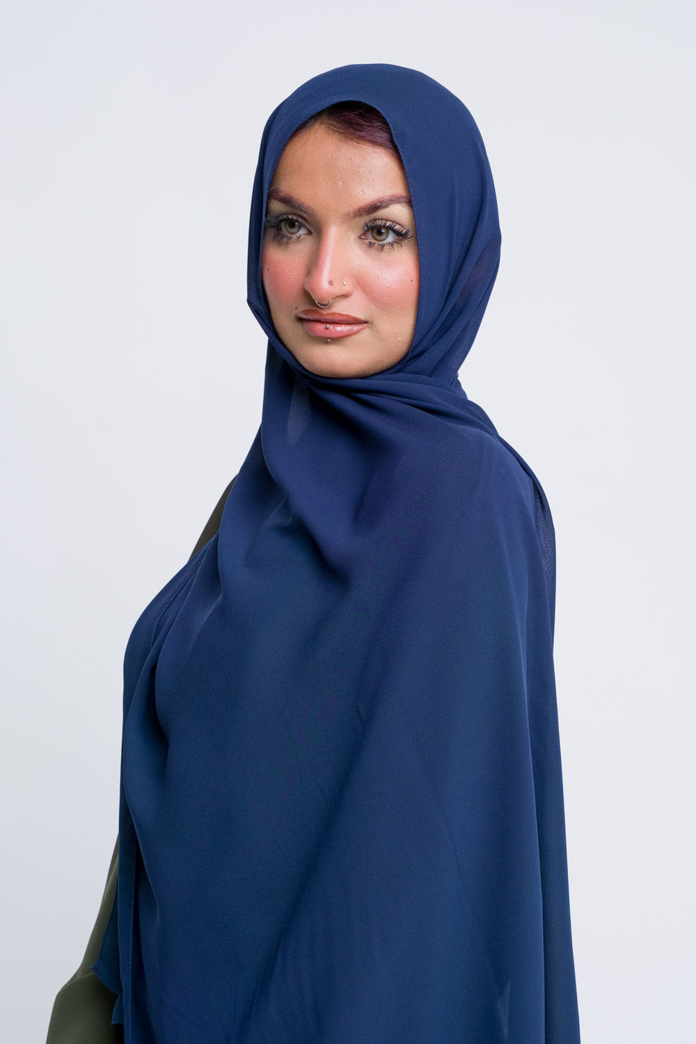 Dark blue chiffon hijab with a fluid drape for formal or everyday modest wear.