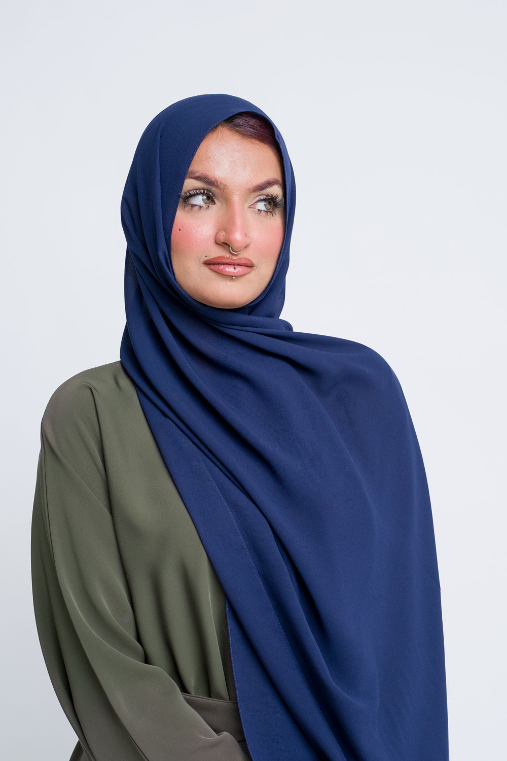 Elegant navy blue chiffon hijab for modest fashion styling.
