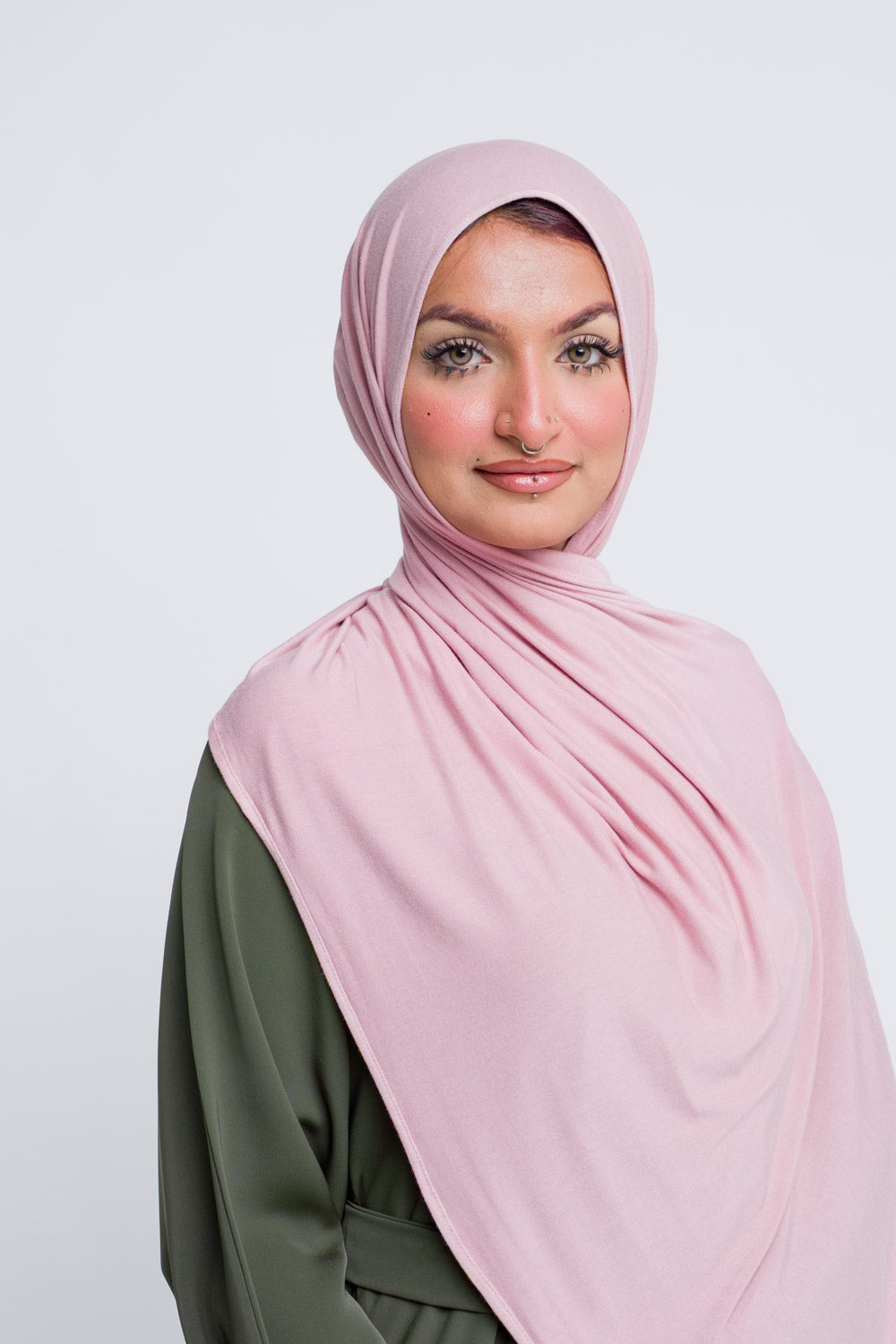 Blush pink hijab in breathable jersey for modern hijabi style.