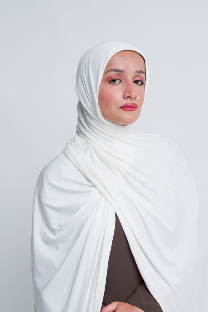 White jersey hijab with breathable stretch fabric and full coverage.