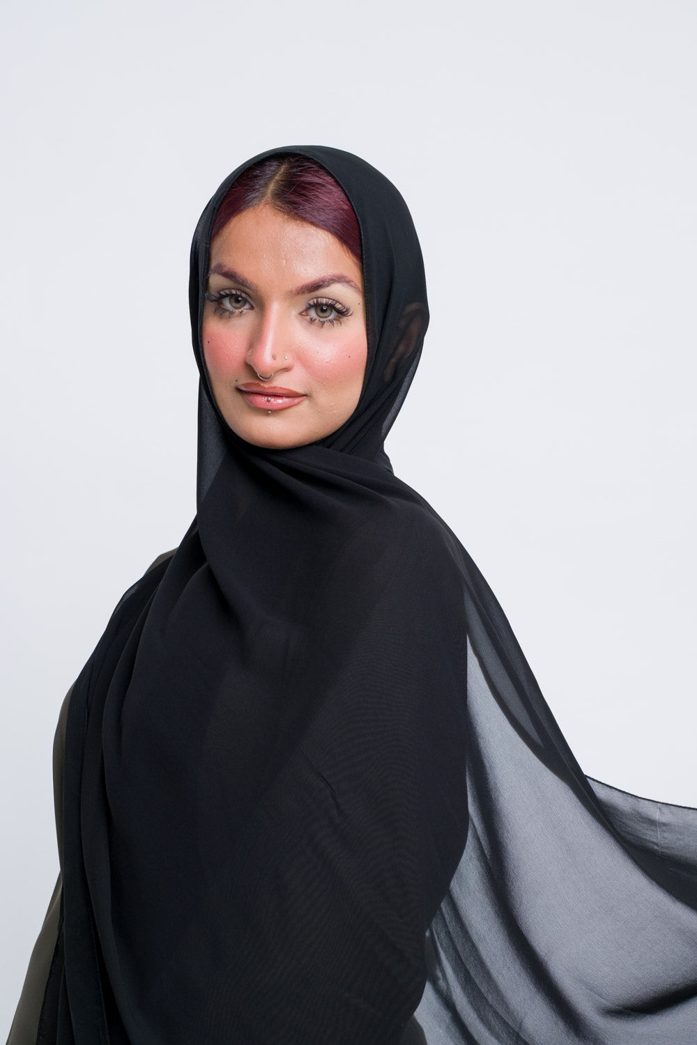 Classic black chiffon hijab with soft texture, ideal for formal hijab styles.